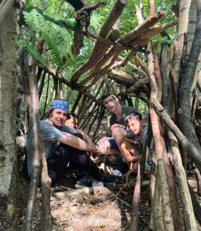 People in a den in a wood - South Western Railway