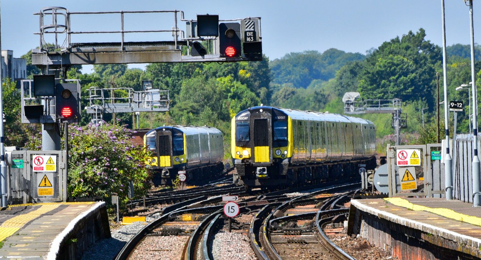 A class 444 and 450 train approaching a station