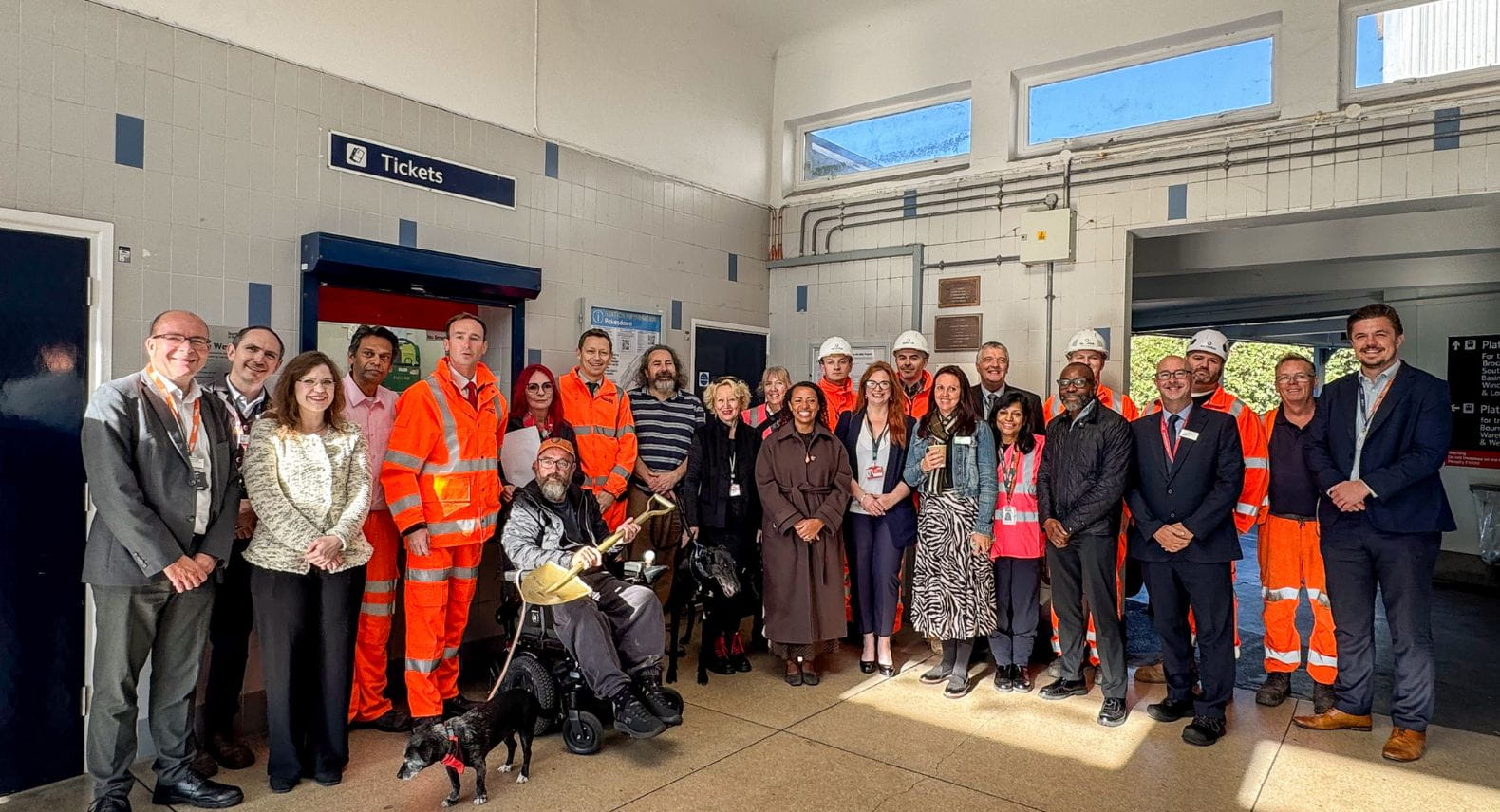 A group of people in Pokesdown station ticket hall