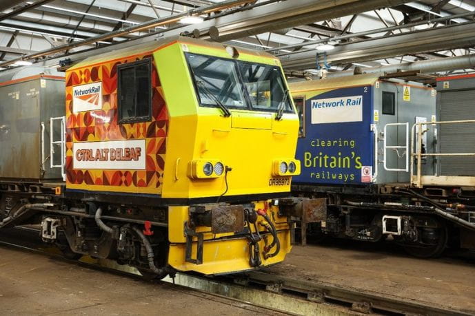 A Multi-Purpose Vehicles (MPVs) use high-pressure water jets to clear leaf mulch and debris from the train tracks / rails