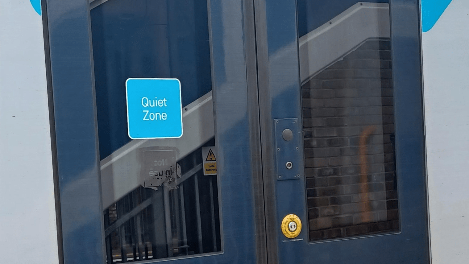 train door with a quiet zone sign