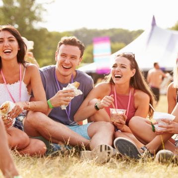 Group enjoying food together at outdoor festival