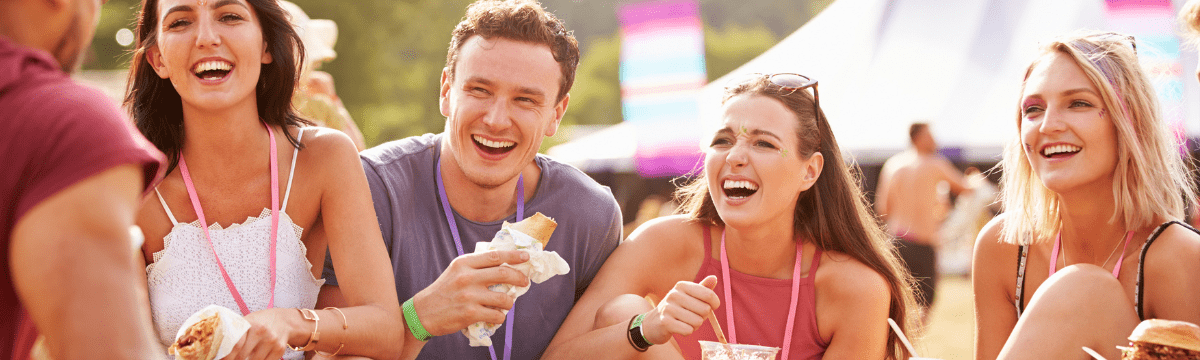 Group enjoying food together at outdoor festival