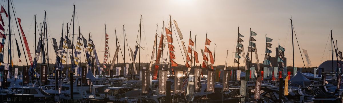 A marina full of boats during sunset