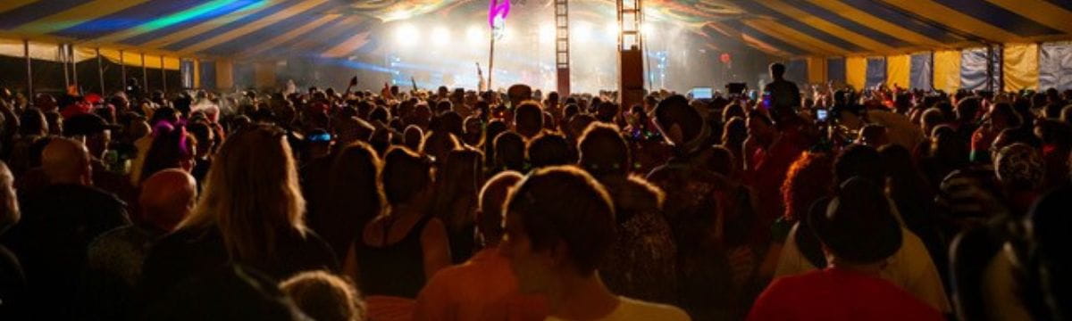A crowd of people in a tent during the festival 