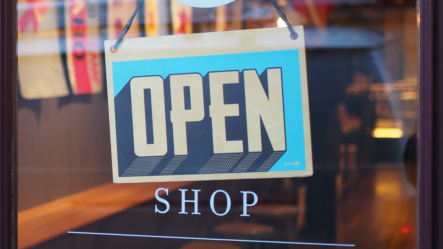 A shop open sign on the door