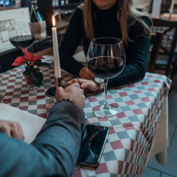 A couple eating dinner at a restaurant